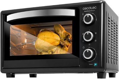 une photo d'un four grille-pain noir contenant un poulet