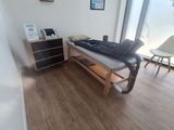 a room with a bed and a chair in it