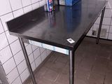 a table with a blue box on it in a kitchen