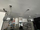 two lights that are hanging from the ceiling in the room