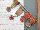 a picture of a picture of a medal and other items