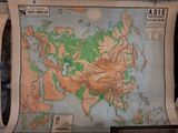 a large map of asia on display in a museum