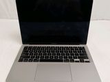 an apple macbook pro laptop computer sitting on top of a white sheet