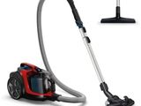 un gros plan d'un aspirateur muni d'un tuyau rouge et noir