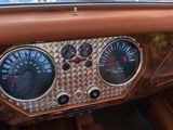 a close up of a car dashboard with gauges and speedometers