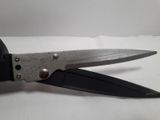 a pair of scissors that are on a table