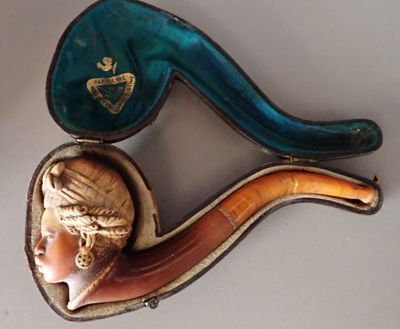 a picture of a pipe with a woman ' s head inside of it