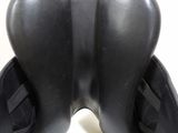 a close up view of a pair of black leather boots