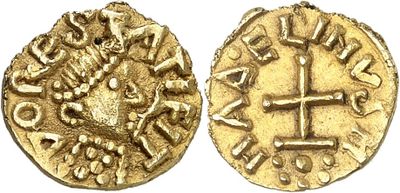a gold coin with a cross on the front and a cross on the back