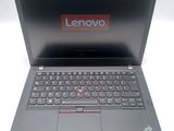 lenovo laptop with a keyboard and mouse on top of it