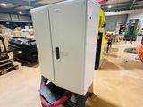a white cabinet that is sitting in a warehouse