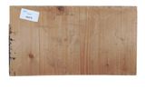 a close up of a piece of wood with a tag on it