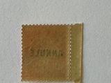 a small piece of paper that has a stamp on it
