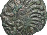 une pièce ancienne sur laquelle figure un visage