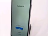 an image of a cell phone sitting on top of a stand