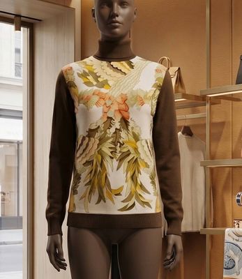 a mannequin in a clothing store with clothing on display