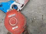 a close up of a red and blue fire hydrant on the ground