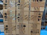 a stack of boxes sitting on a table in a warehouse