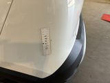 a sticker on the hood of a white car