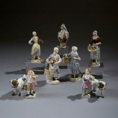 many figurines of people that are standing in a circle