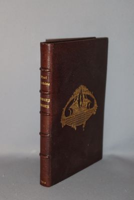 a brown book that has a gold emblem on it