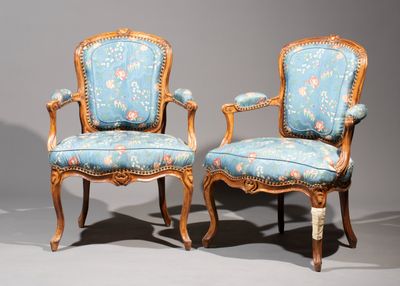 pair of carved wood chairs with blue upholstered upholstered upholstered upholstered upholstered upholstered upholstered