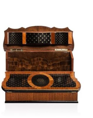 a wooden desk with a keyboard on top of it
