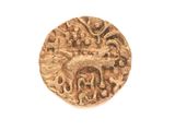 a close up of a gold coin on a white surface