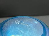 a blue frisbee sitting on top of a table