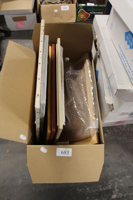 a cardboard box full of laptops and other items in it