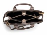 the inside of a brown leather bag on a white background