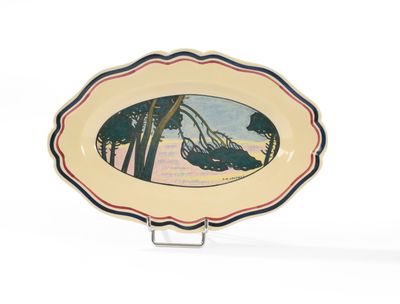 une assiette sur laquelle est représentée une scène de plage