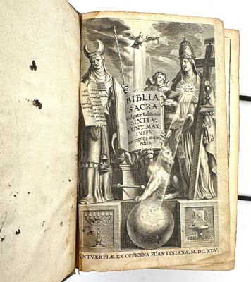an old book with a picture of a man and a dog