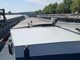a boat that is sitting in the water next to a dock