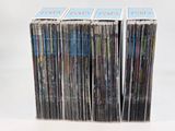 a lot of cds stacked on top of each other