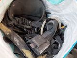 a bag full of assorted items sitting on the floor