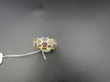 a close up of a ring on a string with a tag