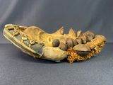 an old baseball glove with nuts and nuts in it