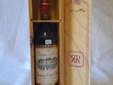 a bottle of wine in a wooden box on a white background