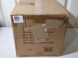 a cardboard box sitting on a table with a sticker on it