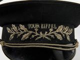 a black hat with gold embroidery on the front of it