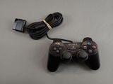 a video game controller that is connected to a charger