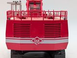a red toy truck with a crane on top of it