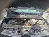a car with its hood open and the engine in the trunk