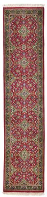 un tapis rouge et vert sur fond blanc