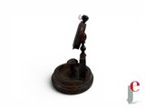 a small statue of a man on a pedestal