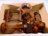 a cardboard box filled with different types of wooden objects