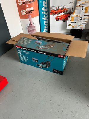 a box that is sitting on the floor next to a red object