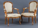 pair of louis xv style walnut armchairs with upholstered upholstered seats