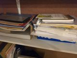 a book shelf with a lot of books on top of it